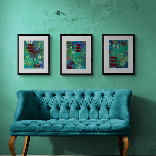 Cozy corner with 2-seater in teal green and three eco-friendly artworks